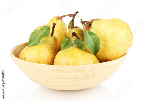 Juicy pears in wooden bowl isolated on white