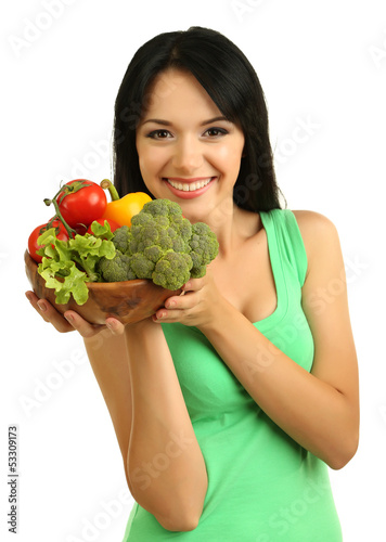 Girl with vegetables isolated on white © Africa Studio