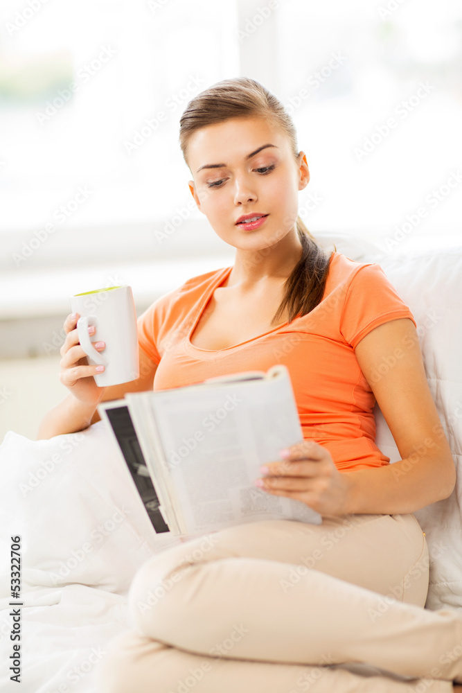 woman with cup of coffee reading magazine at home woman with cup of coffee reading magazine at home