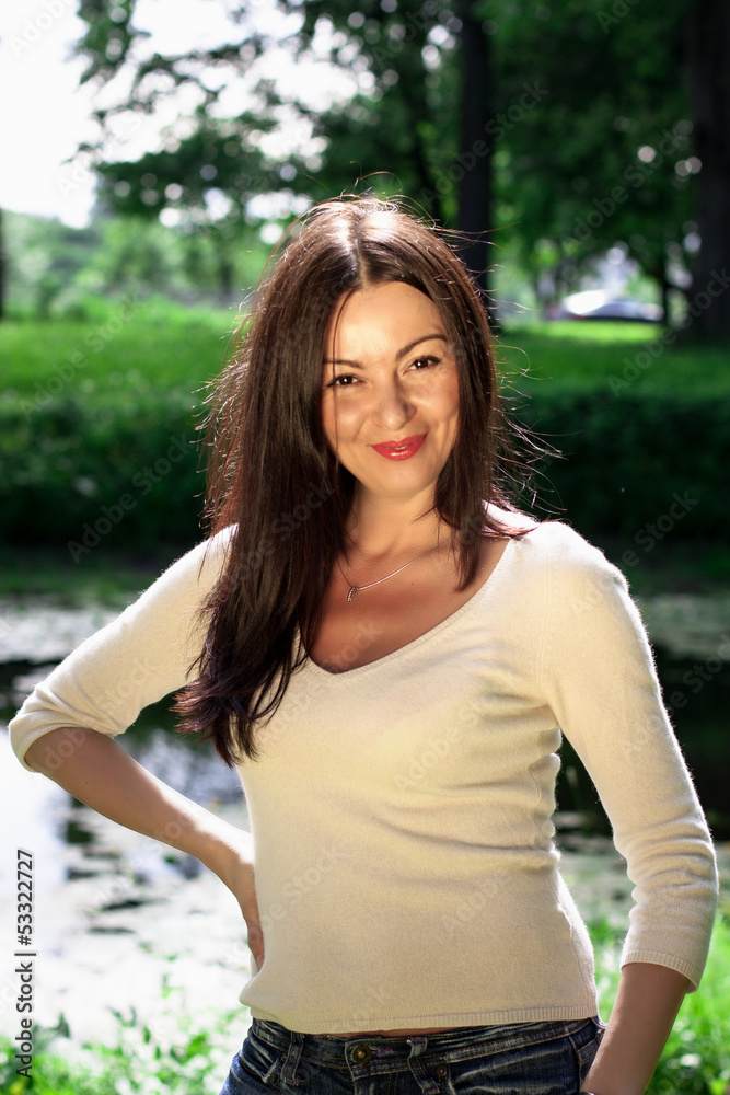 Beautiful young woman in the park. Outdoor portrait