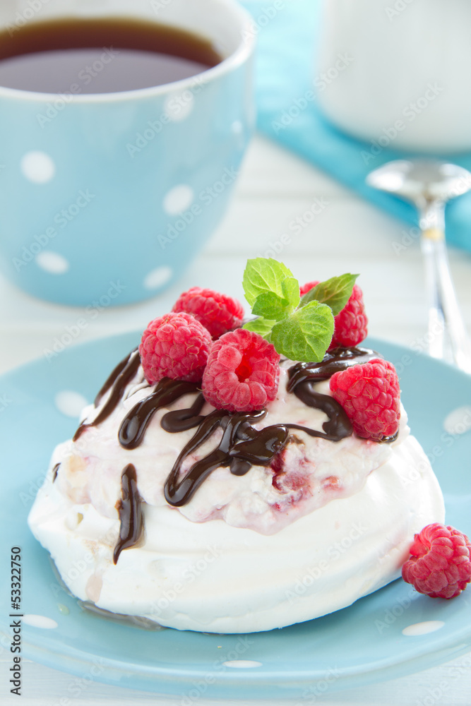 Meringue with raspberry cream, raspberry and chocolate.