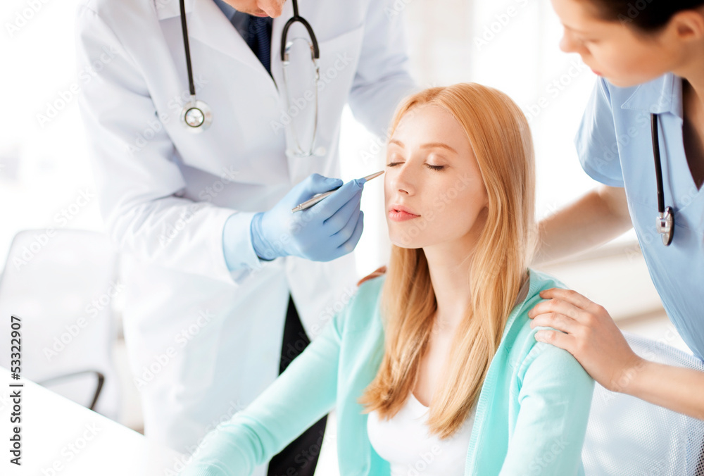 male plastic surgeon with patient male plastic surgeon with patient