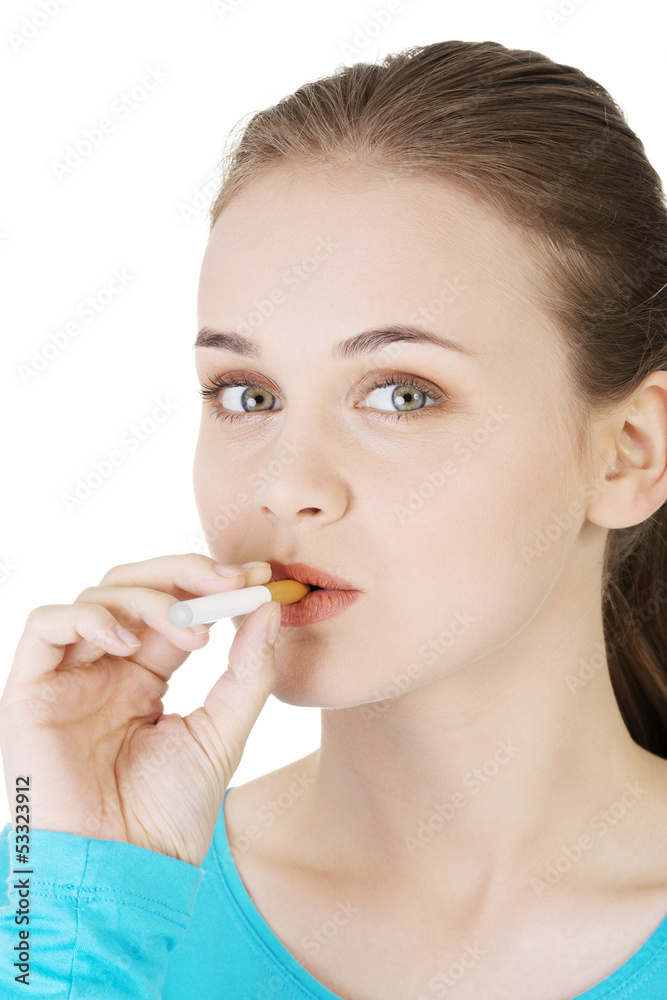 Young woman smoking electronic cigarette (ecigarette) Young woman smoking electronic cigarette (ecigarette)