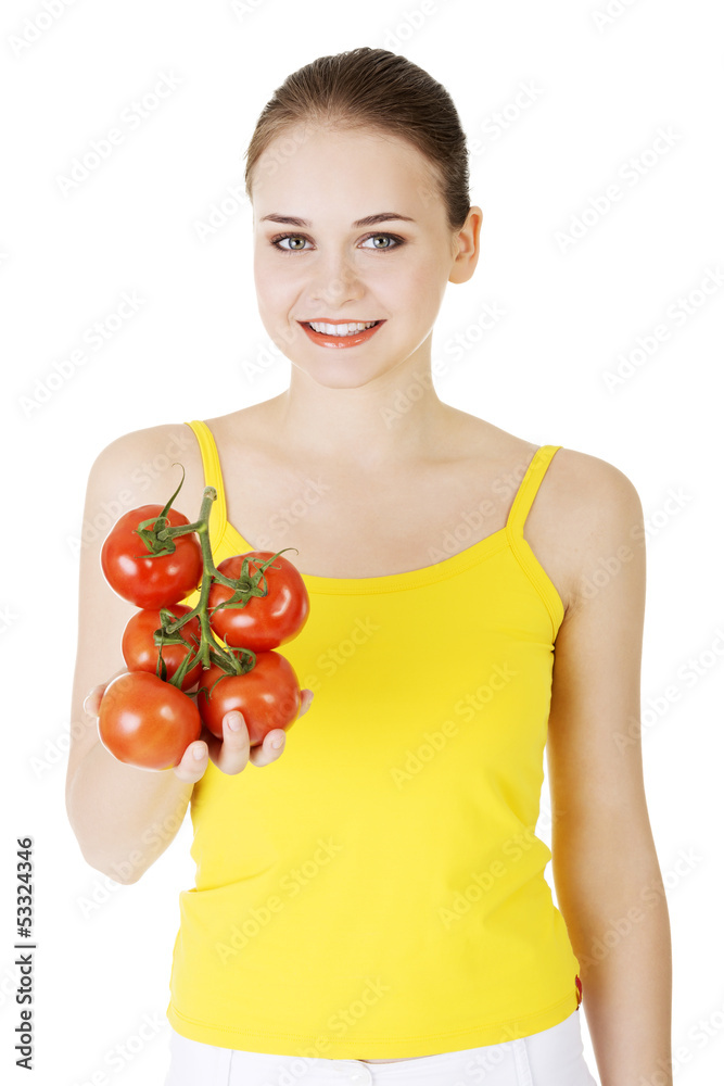 Young woman with tomato. Young woman with tomato.