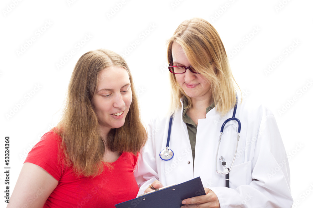Female doctor explaining document to female patient Female doctor explaining document to female patient