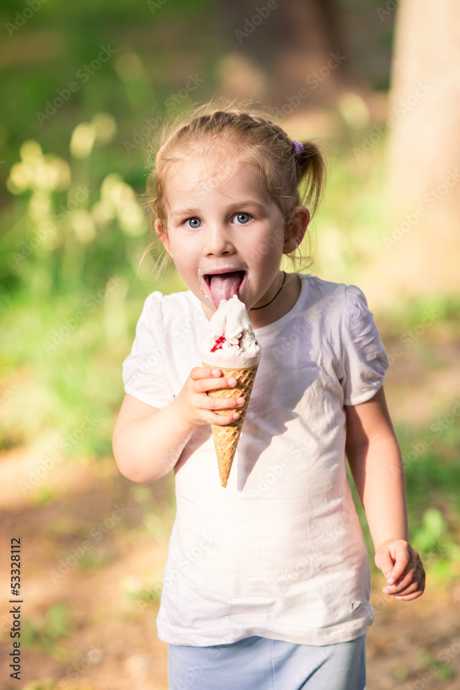 Happy cute child eating ice cream Happy cute child eating ice cream