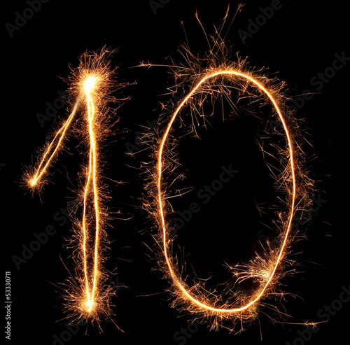 Number "ten" sparklers on black background