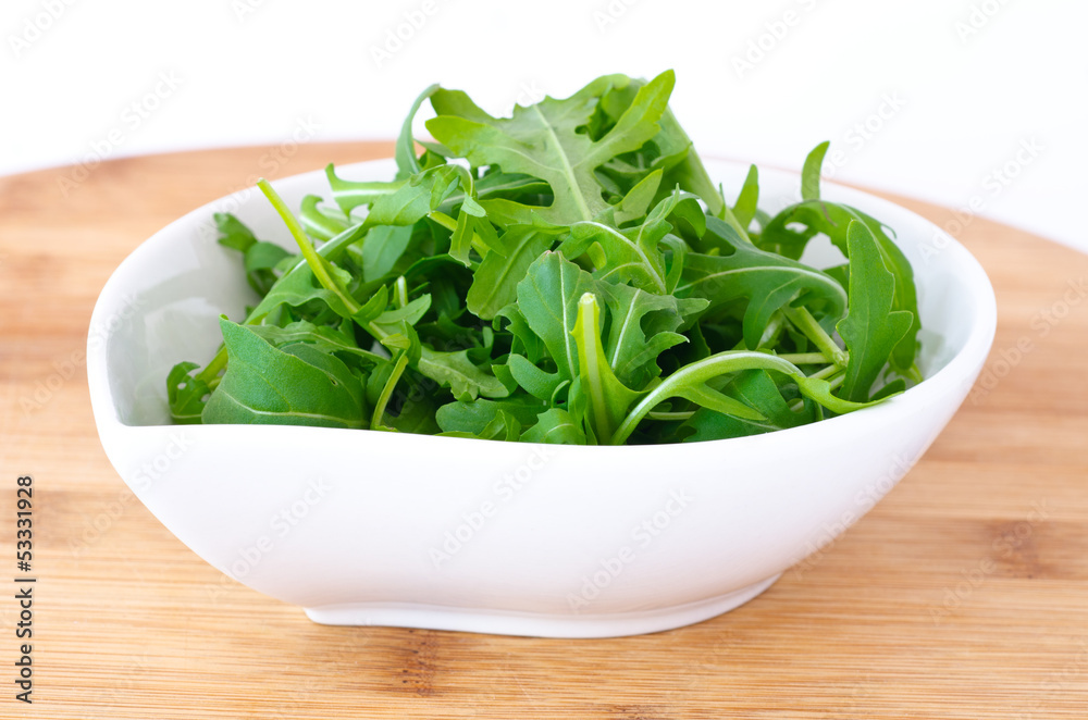 bowl of fresh green, natural arugula bowl of fresh green, natural arugula