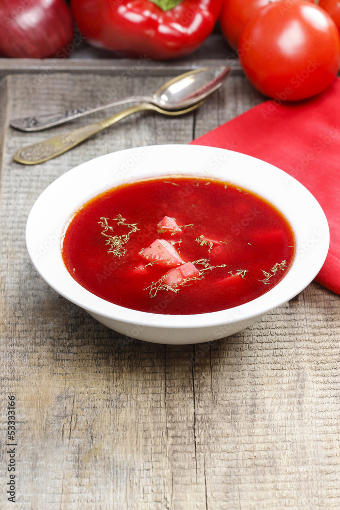 Traditional beetroot soup on old wooden table Traditional beetroot soup on old wooden table