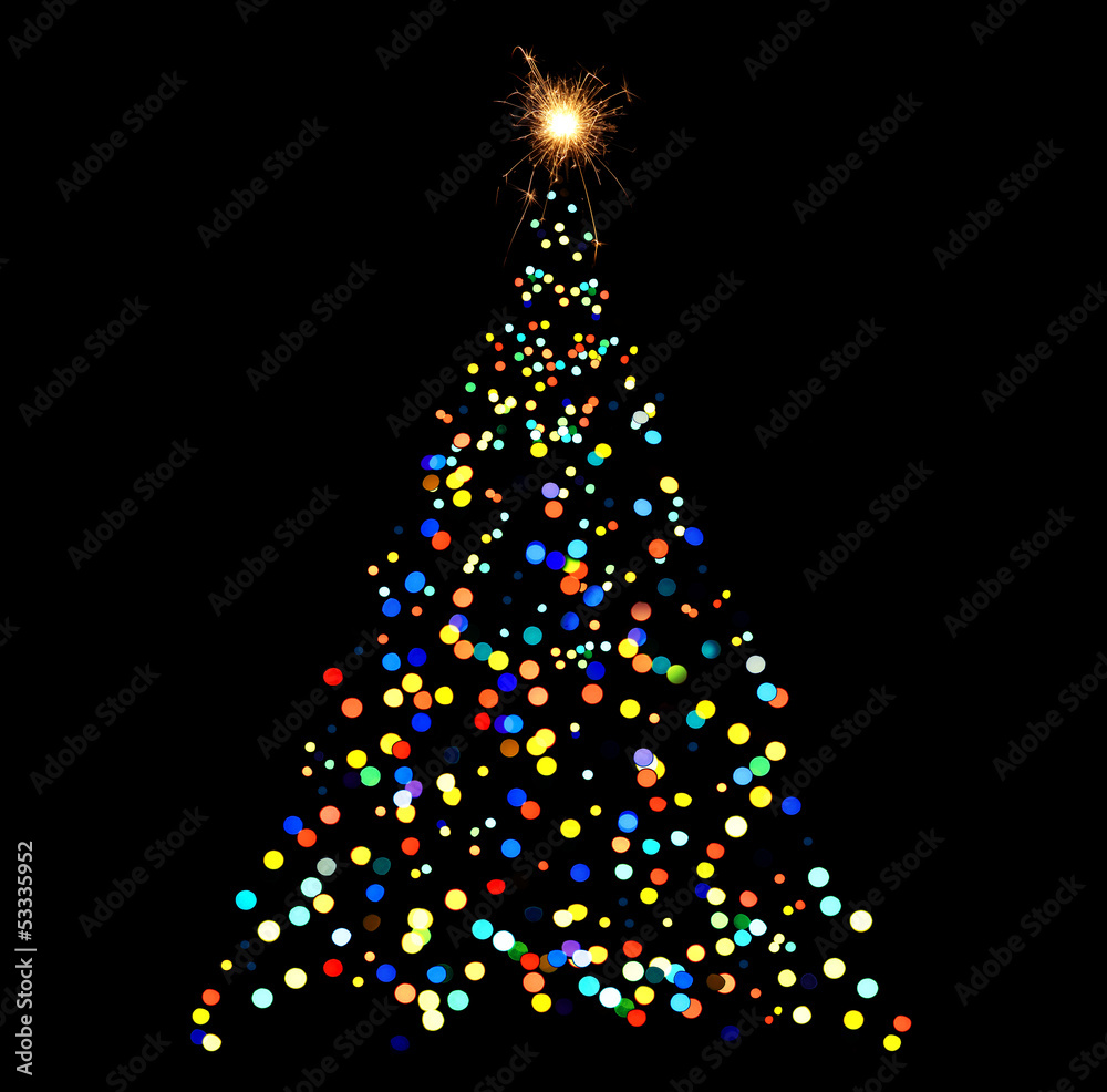 Christmas tree-shaped sparklers on black background Christmas tree-shaped sparklers on black background