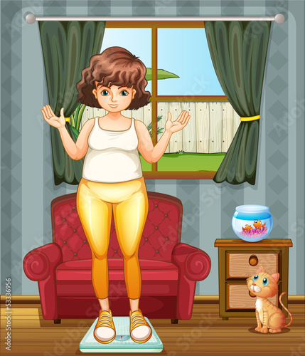 A girl measuring her weight at the weighing scale