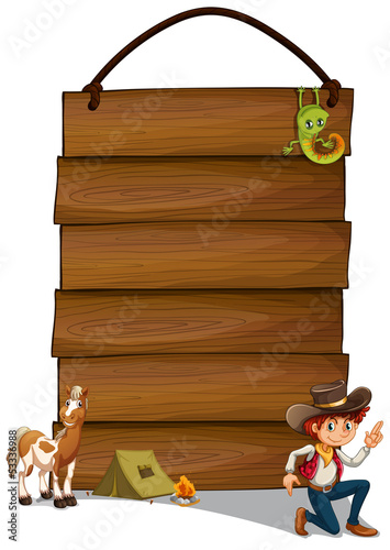 A hanging empty signage with a cowboy and animals