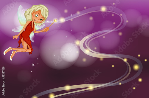 A fairy holding a sparkling wand