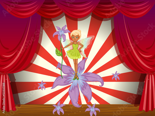 A fairy at the stage with flowers