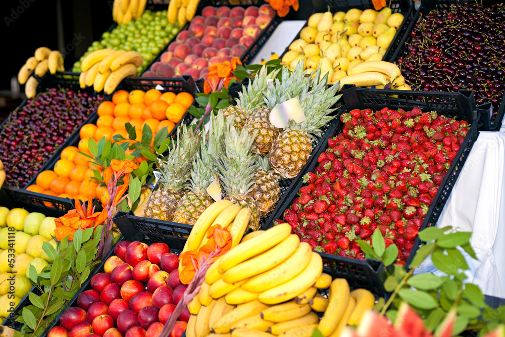 fruits and berries on display at the market