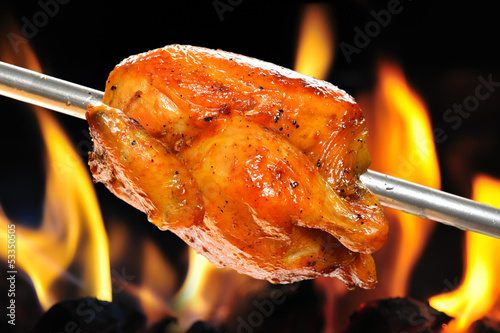 roasted chicken on flame background
