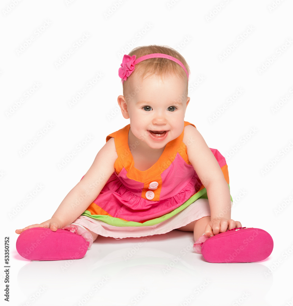 happy little baby girl in bright multicolored festive dress isol happy little baby girl in bright multicolored festive dress isol