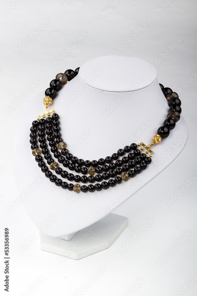 natural stone beads necklace on a stand natural stone beads necklace on a stand