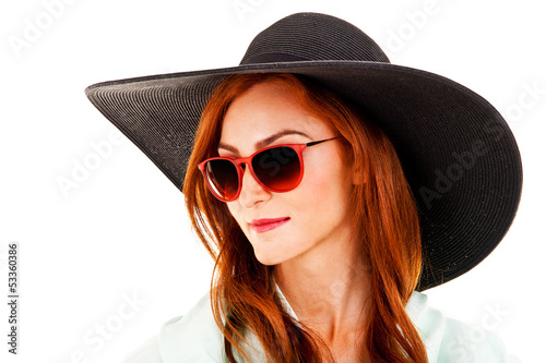 Portrait of attractive elegant woman in black hat