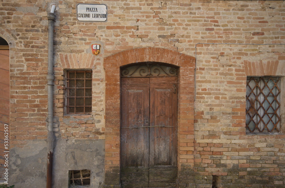 Montottone, Giacomo Leopardi's square, closed door Montottone, Giacomo Leopardi's square, closed door