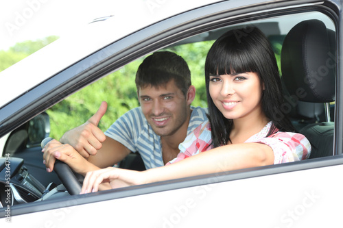 Beautiful happy young couple driving car © Africa Studio