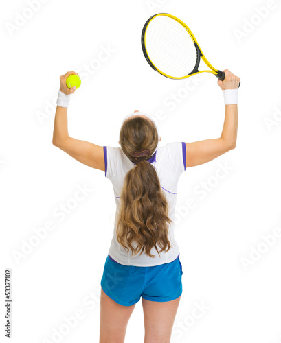 Happy female tennis player rejoicing success. rear view © Alliance