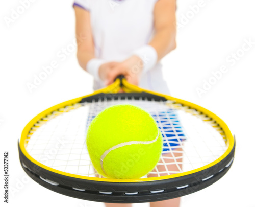 Closeup on tennis ball on racket in hand of female tennis player © Alliance