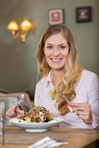 Young Woman With Plate Of Meat Salad