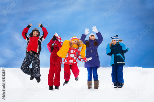 Kids jumping in snow
