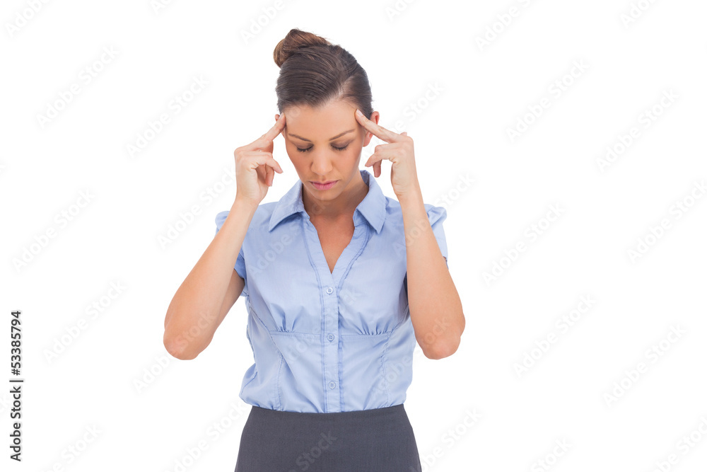 Businesswoman thinking with fingers on her temples Businesswoman thinking with fingers on her temples