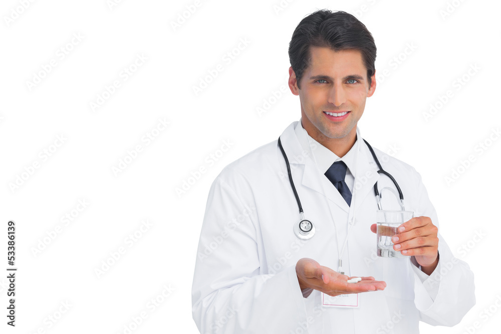 Happy doctor smiling and holding medicine Happy doctor smiling and holding medicine