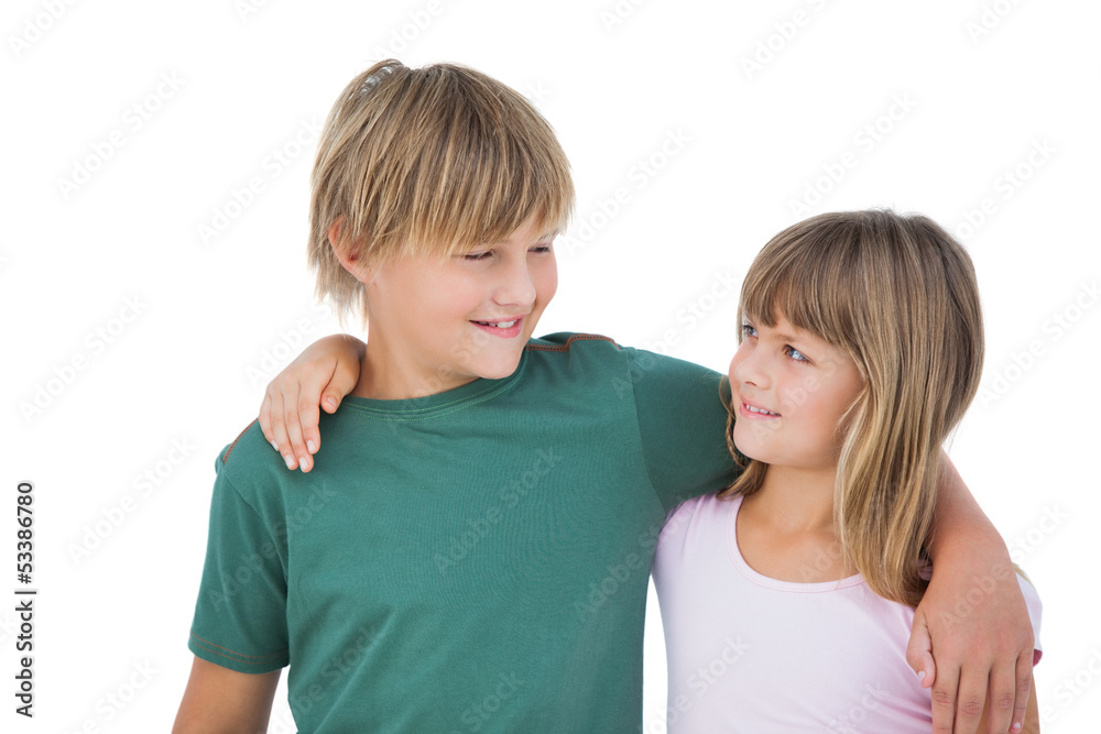 Little boy and girl looking each other and smiling