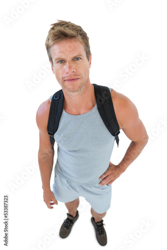 Attractive man in sportswear looking at camera