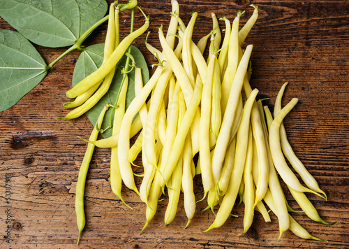 yellow beans - on a wooden background