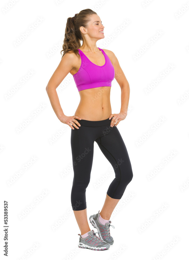 Full length portrait of healthy woman looking on copy space Full length portrait of healthy woman looking on copy space