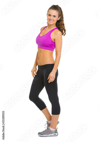 Full length portrait of smiling fitness young woman © Alliance