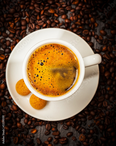 Espresso cup in coffee beans