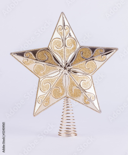 Gold star Christmas tree decoration on white background