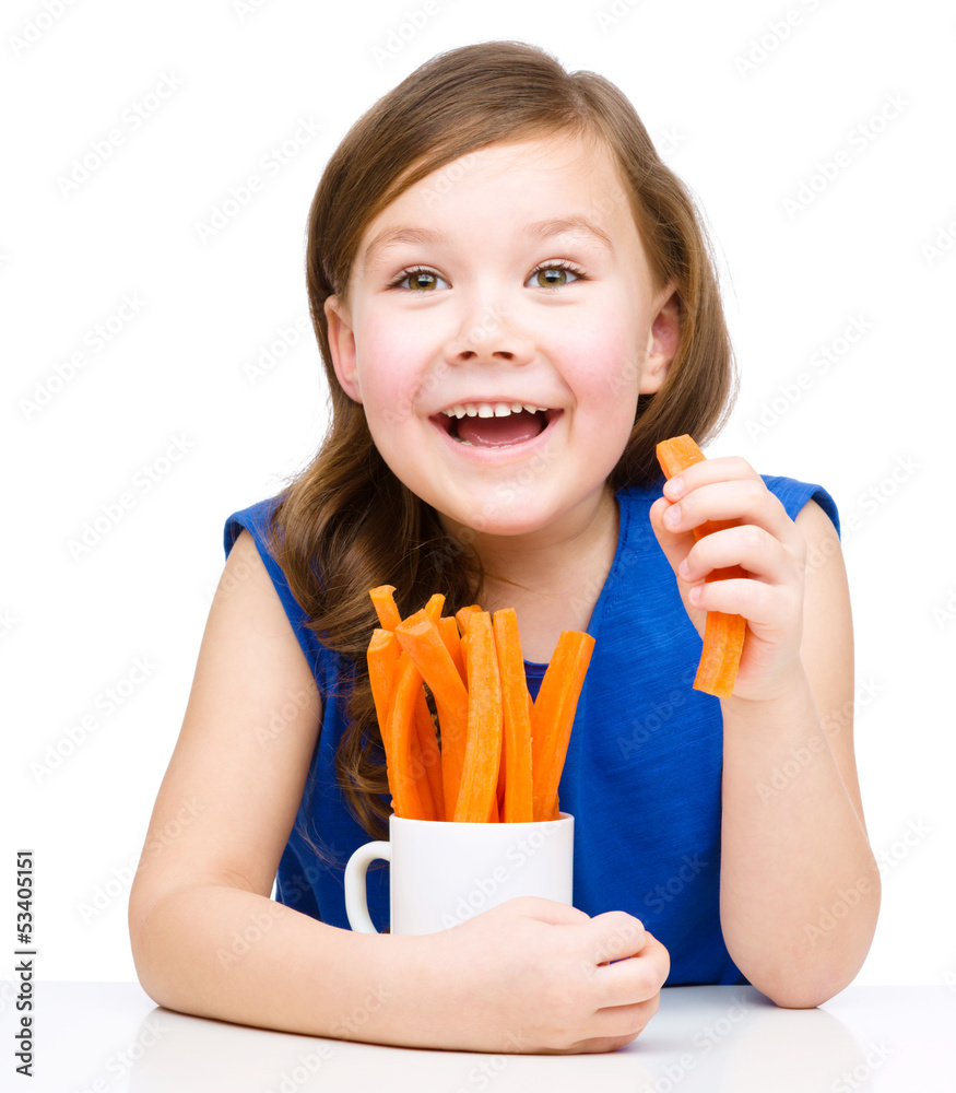 Cute little girl is eating carrot Stock Photo Adobe Stock