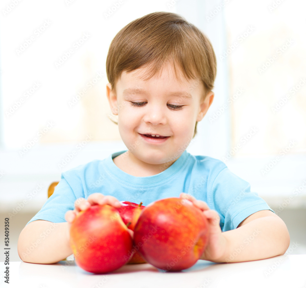 Portrait of a happy little boy with apples Portrait of a happy little boy with apples