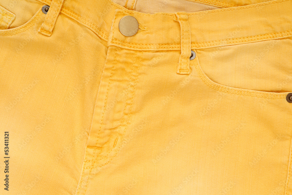 It is a closeup of yellow jeans.