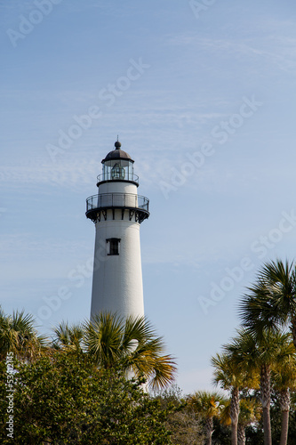 White Lighthouse Beyond Palm Trees