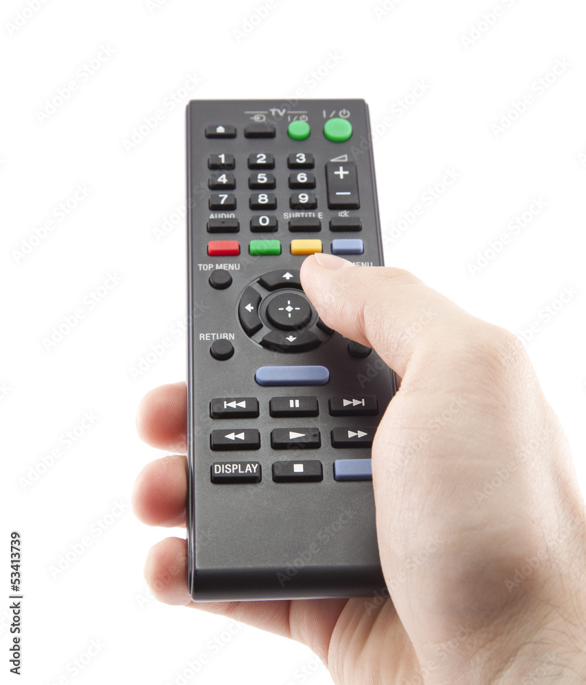 Hand pressing remote control isolated on white Hand pressing remote control isolated on white
