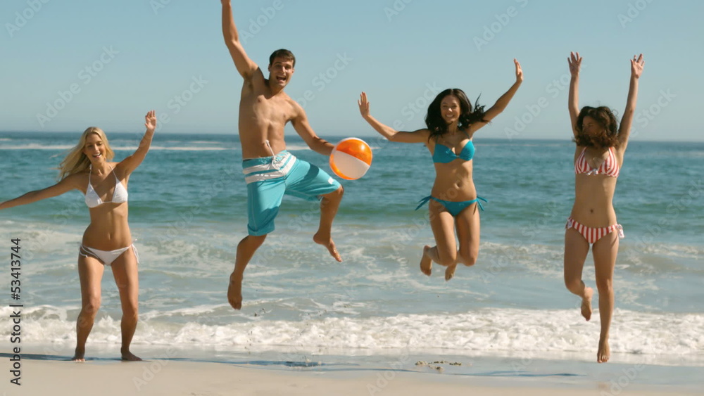 Group of friends jumping on the beach Group of friends jumping on the beach