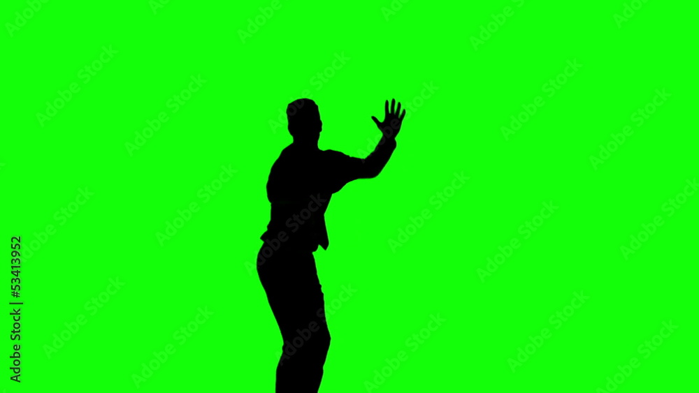 Silhouette of man jumping raising legs on green screen