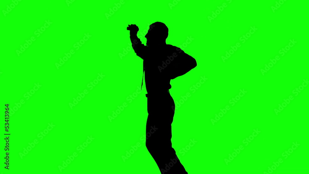 Silhouette of a man jumping on green screen Silhouette of a man jumping on green screen