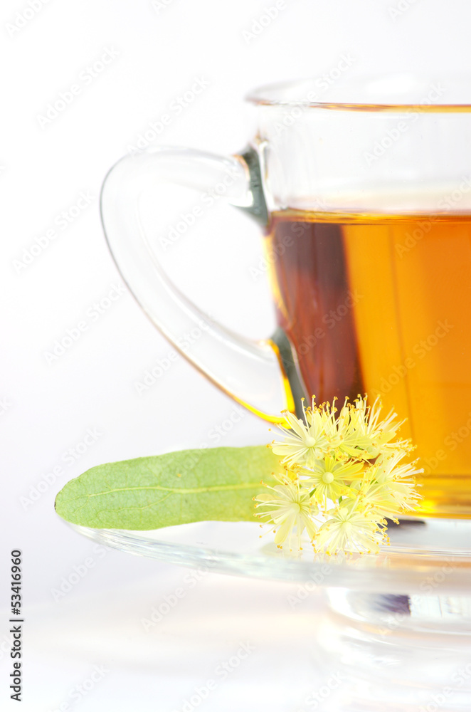 Glass cup of tea with linden isolated on white Glass cup of tea with linden isolated on white