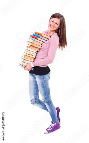 Smiling girl carrying books