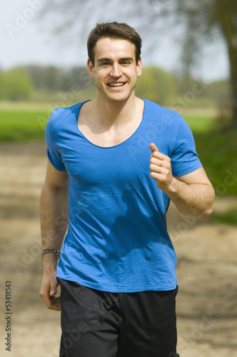 smiling man jogging front