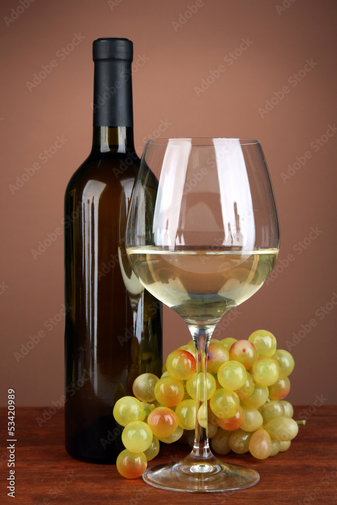 Fototapeta premium Composition of wine bottle, glass of white wine, grape
